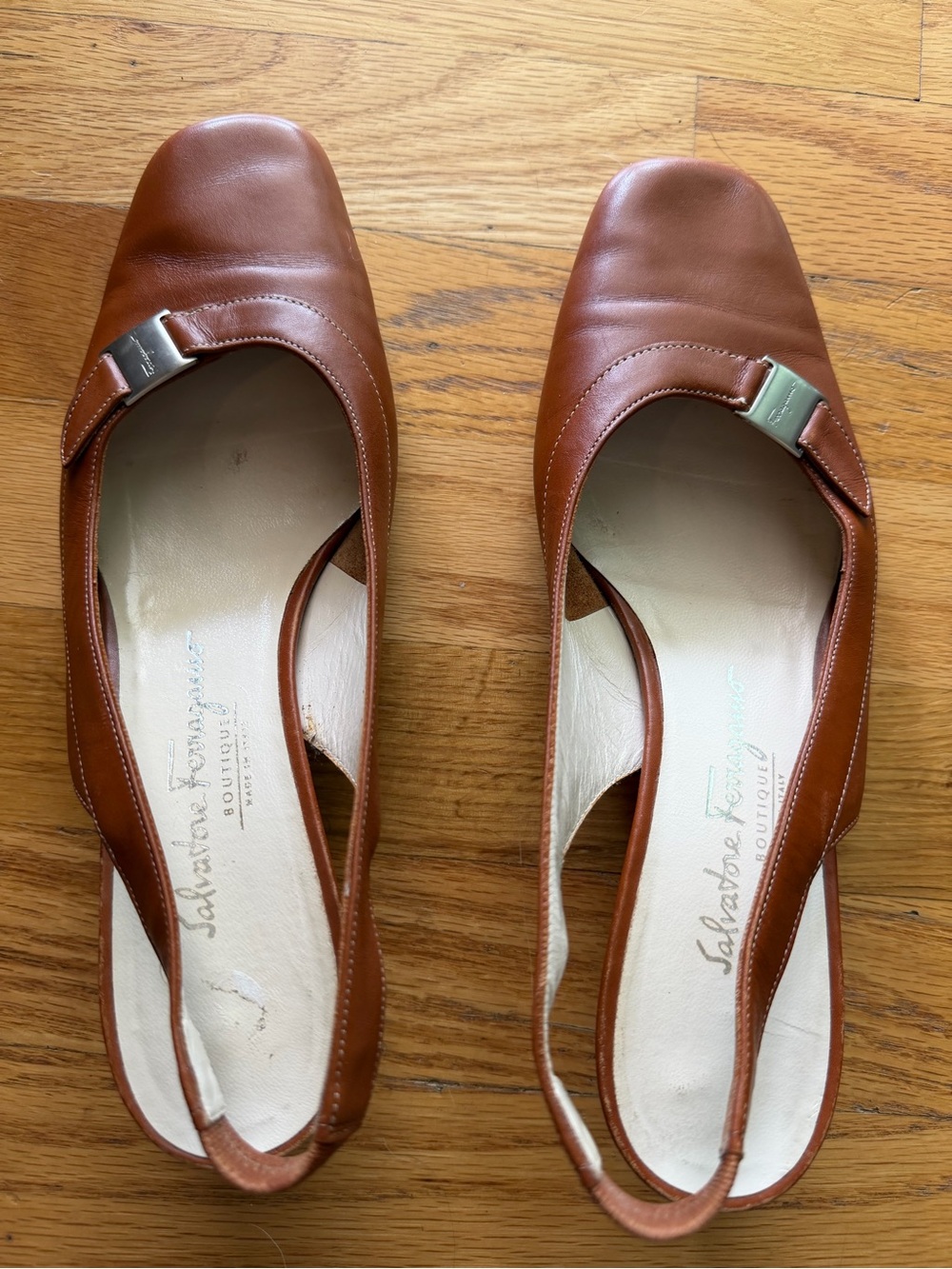 Brown leather Salvatore Ferragamo slingback heels with a subtle square toe